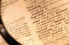 Magnifying Glass over Dictionary