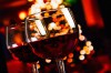 Two Red Wine Glass Against Christmas Lights Decoration Background